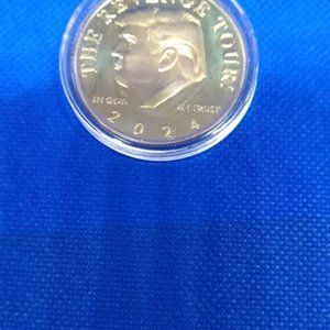 1 Trump Silver Coin and 1 Trump Gold Coin